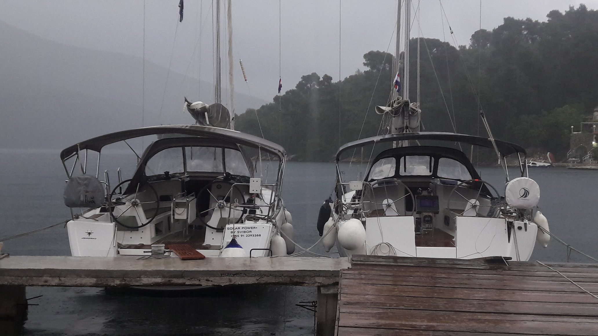 Two boats in the rain